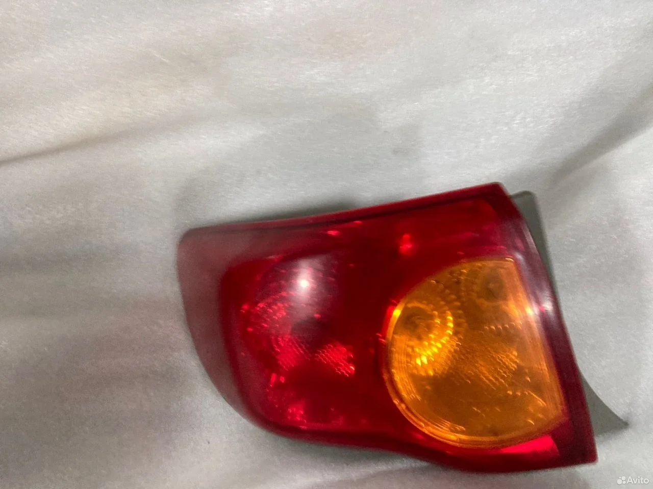 Фонарь задний левый toyota corolla 150