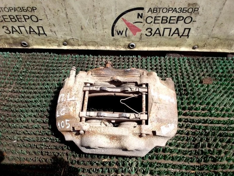 Суппорт тормозной Toyota Land Cruiser 105 4773060110 HZJ105L 1HZ, передний левый