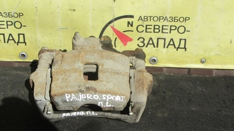 Суппорт Mitsubishi Pajero Sport 4605A201 KH 4D56U, передний левый