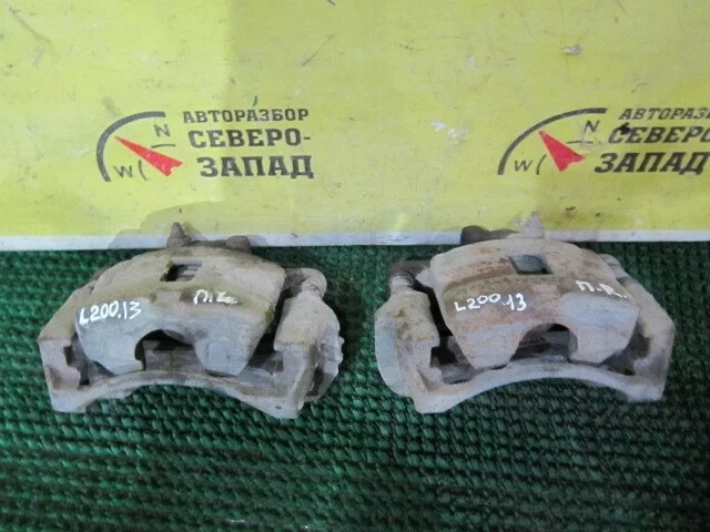 Суппорт Mitsubishi L200 4605A201 KB4T 4D56, передний левый