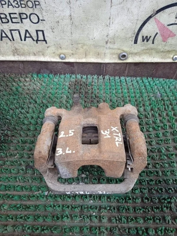 Суппорт Nissan X-Trail 44011JG00A T31, задний левый