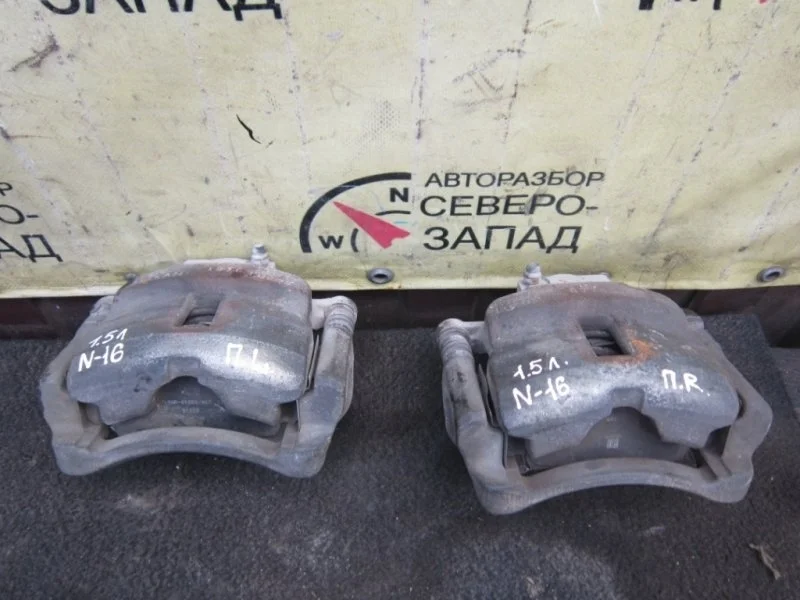 Суппорт Nissan Almera 410112F522 N16 QG15, передний левый