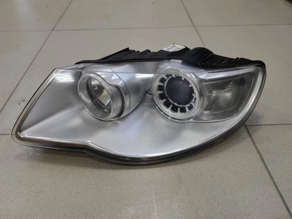 Фара Volkswagen Touareg 2007 7L6941031C 7LA BKS, левая