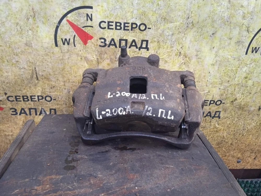 Суппорт Mitsubishi L200 2011 4605A201 KB4T 4D56-6-DFL, передний левый