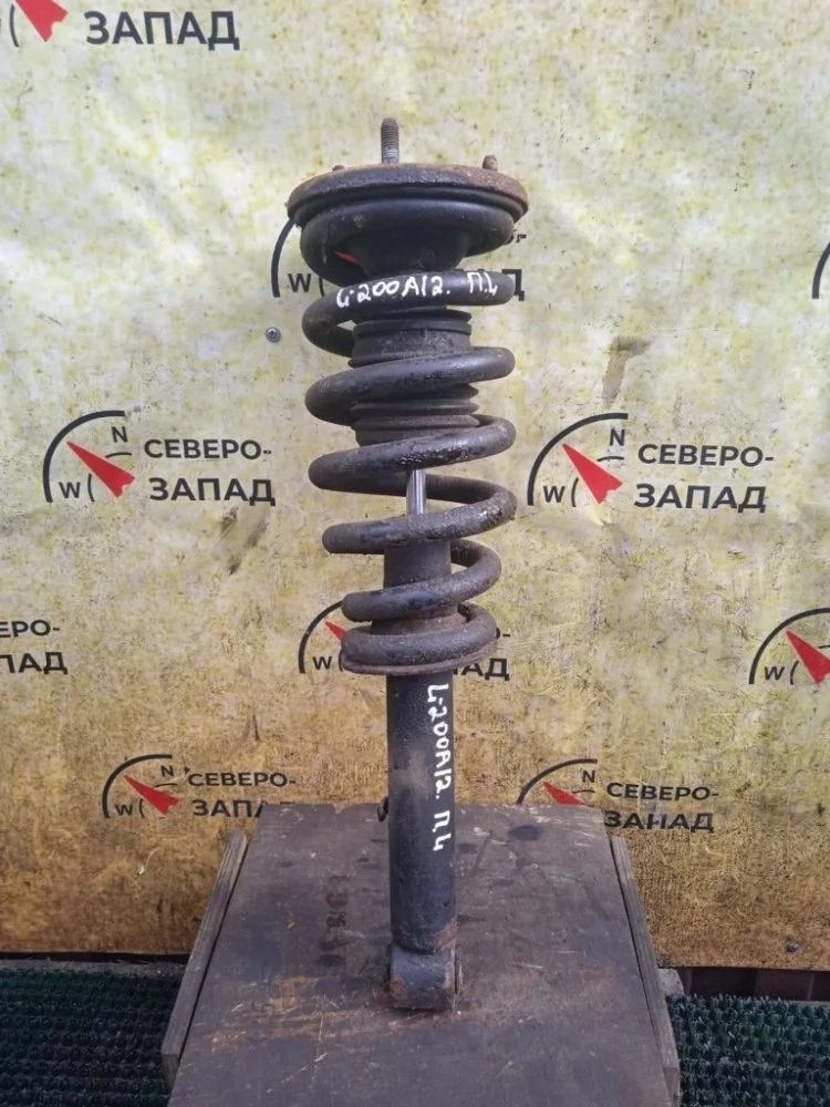 Амортизатор Mitsubishi L200 2011 MR992321 KB4T 4D56-6-DFL, передний