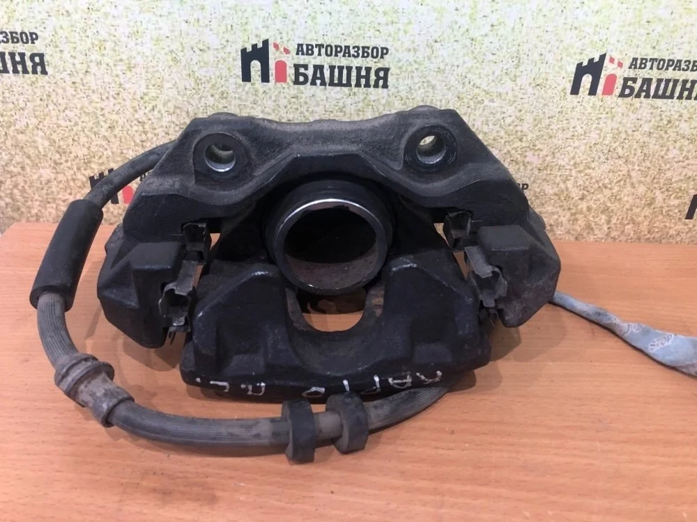 Суппорт тормозной Skoda Rapid 1K0615123E, передний левый