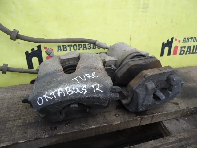 Суппорт Skoda Octavia 1K0615123D, передний левый