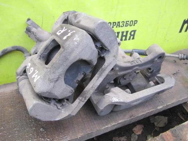 Суппорт тормозной Mazda 6 GHY92699ZB GJ, задний левый