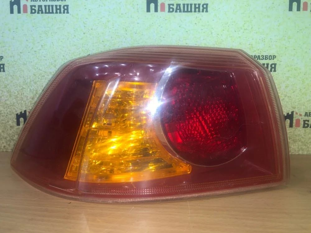 Фонарь Mitsubishi Lancer 2008 8330A607 CY, левый