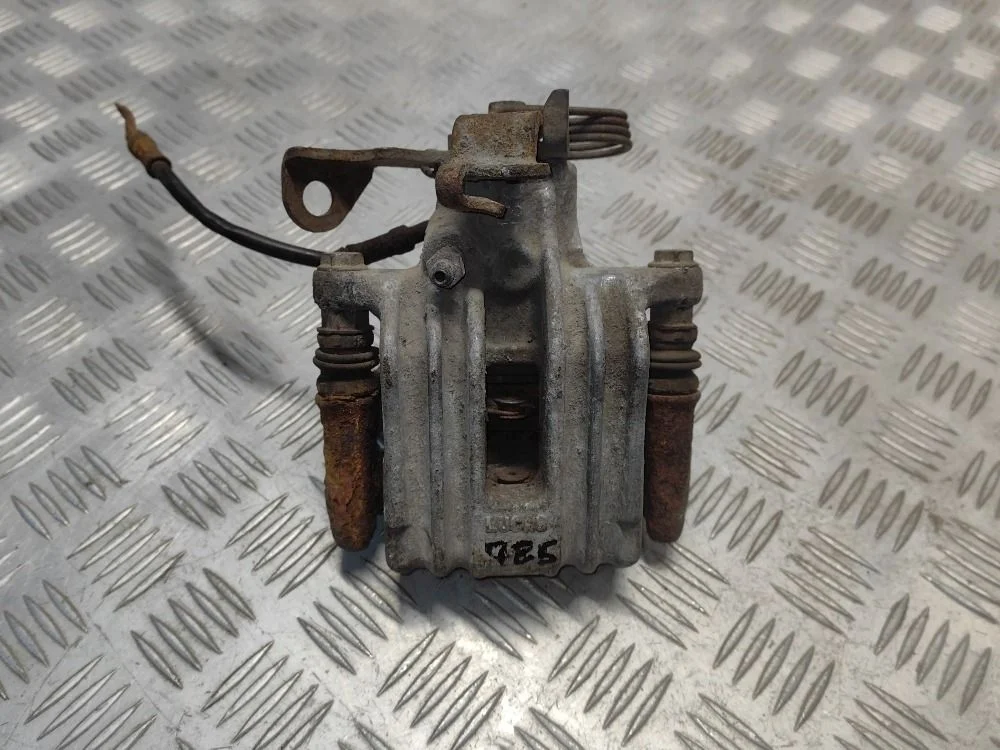 Суппорт тормозной задний левый VW Passat B5+