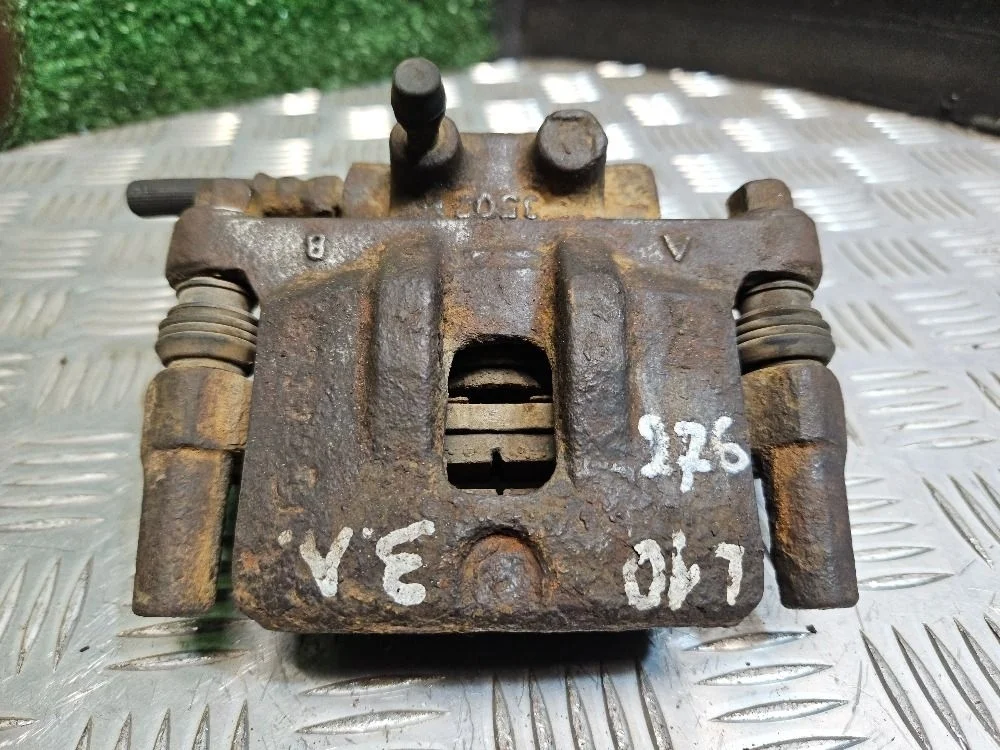 Суппорт задний левый на Mitsubishi Lancer 10