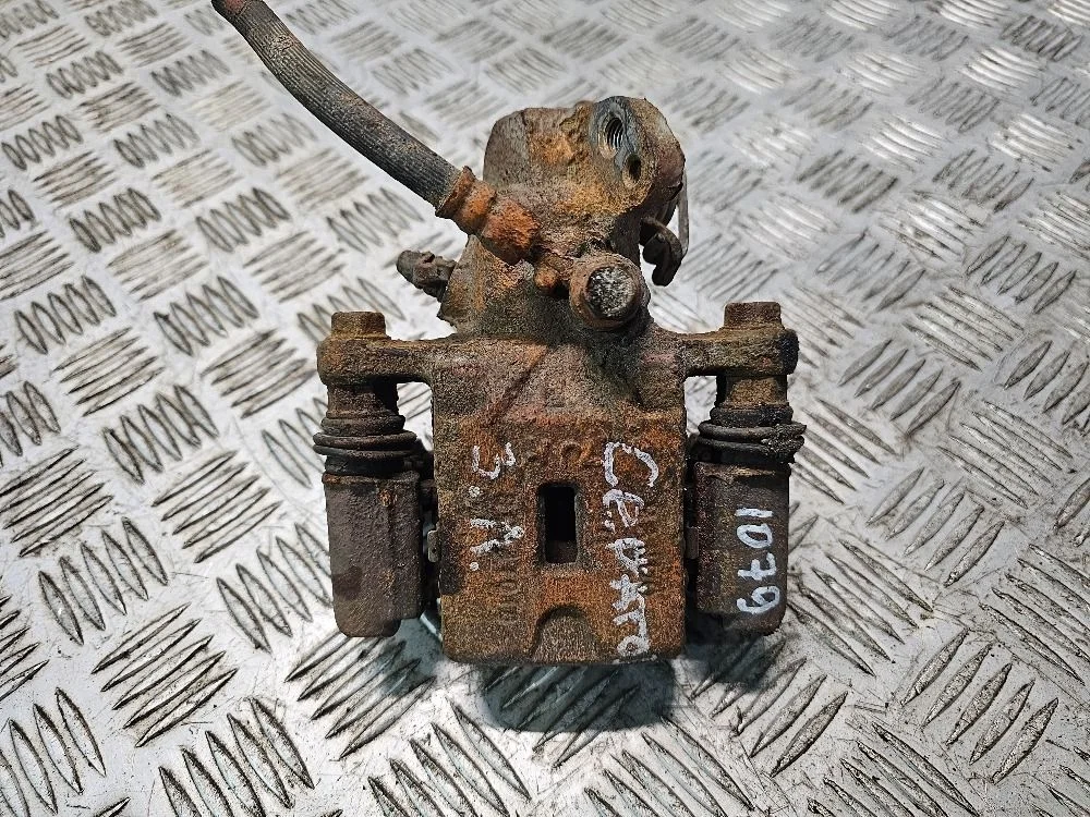 Суппорт тормозной задний левый Kia Cerato