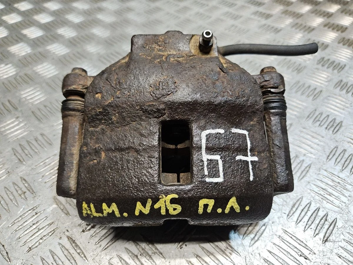 Суппорт передний левый на Nissan Almera N16