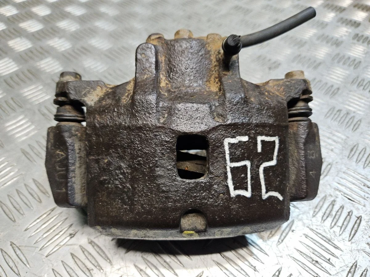 Суппорт передний левый на Mitsubishi Lancer 9