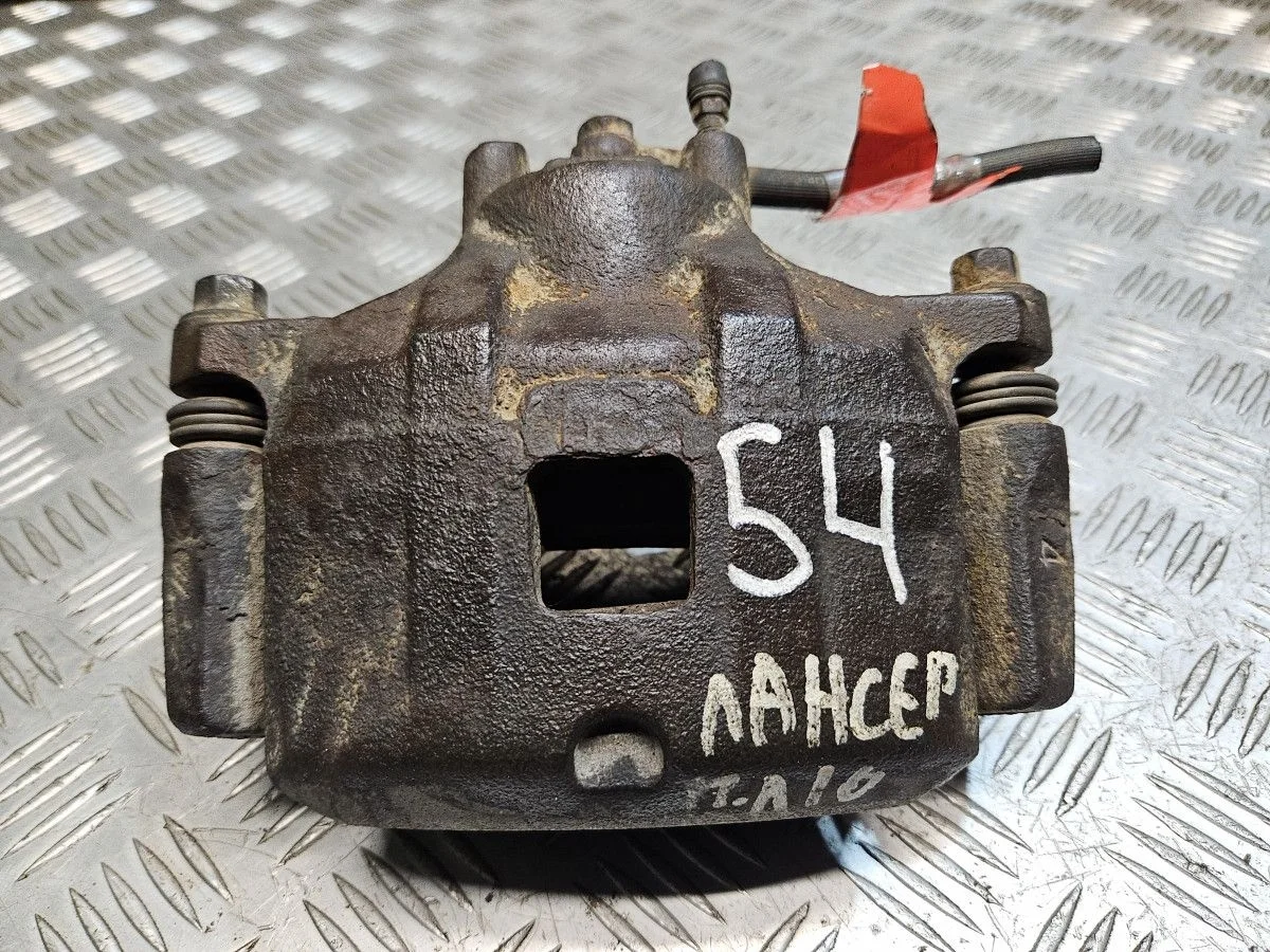 Суппорт передний левый на Mitsubishi Lancer 10