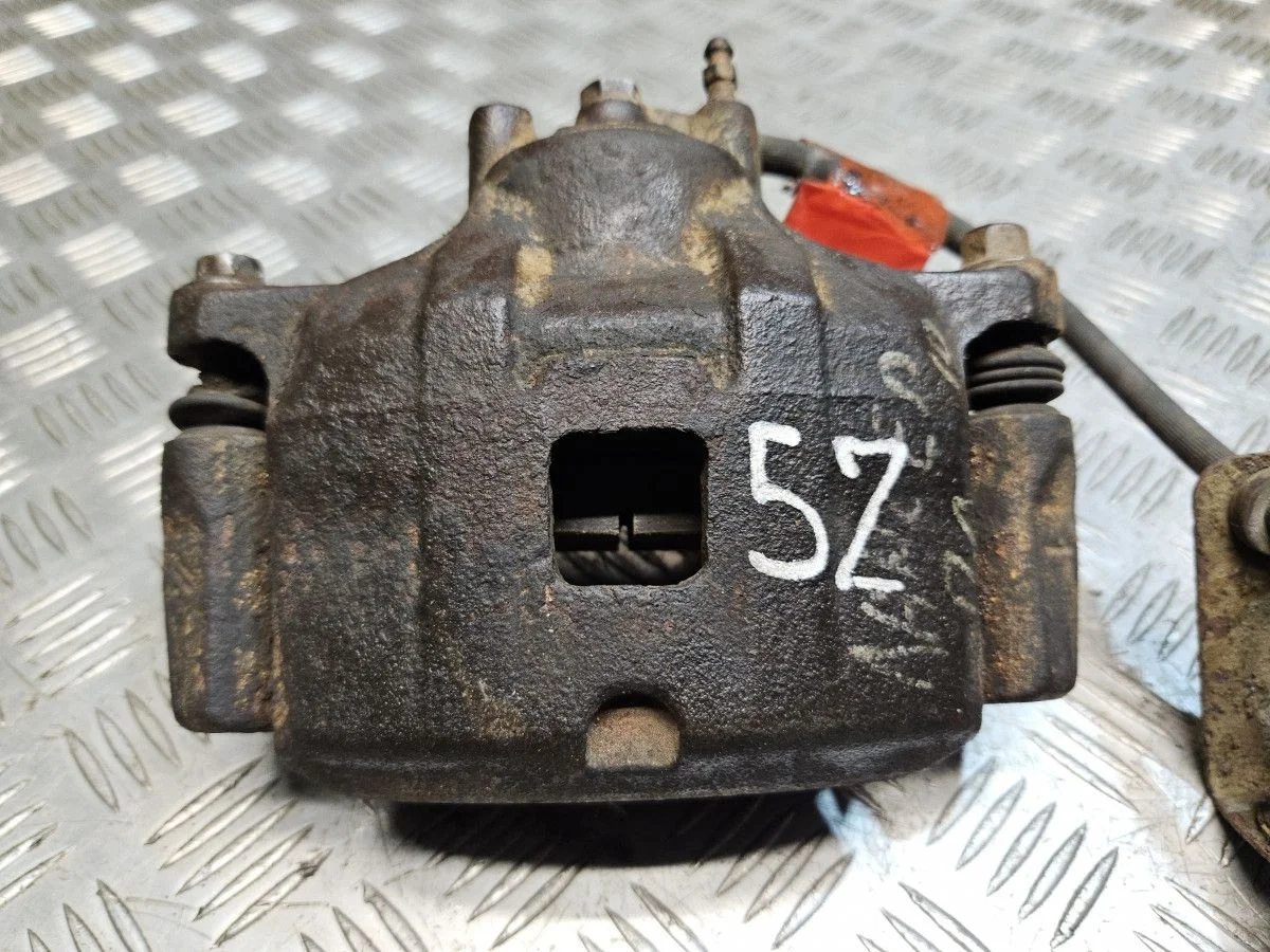 Суппорт передний левый на Mitsubishi Lancer 10