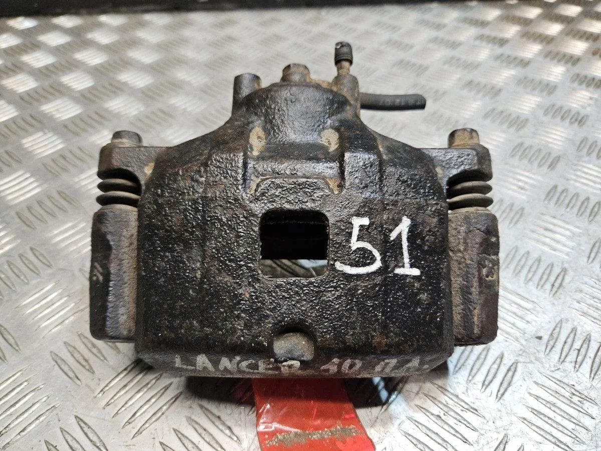 Суппорт передний левый на Mitsubishi Lancer 10