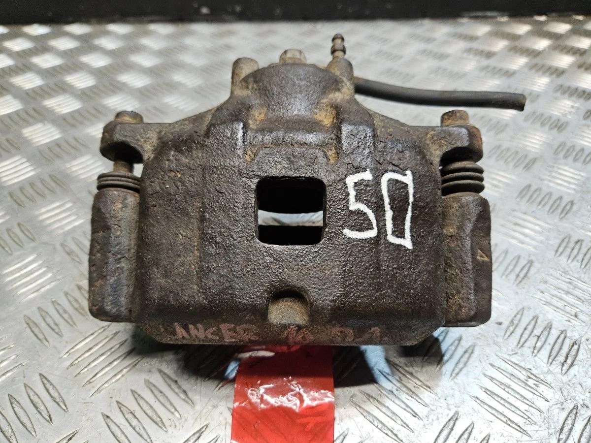 Суппорт передний левый на Mitsubishi Lancer 10