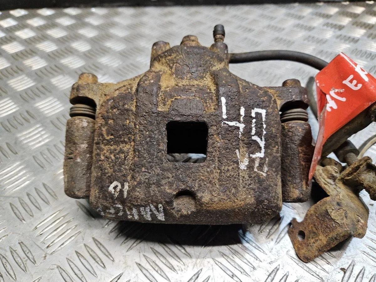 Суппорт передний левый на Mitsubishi Lancer 10