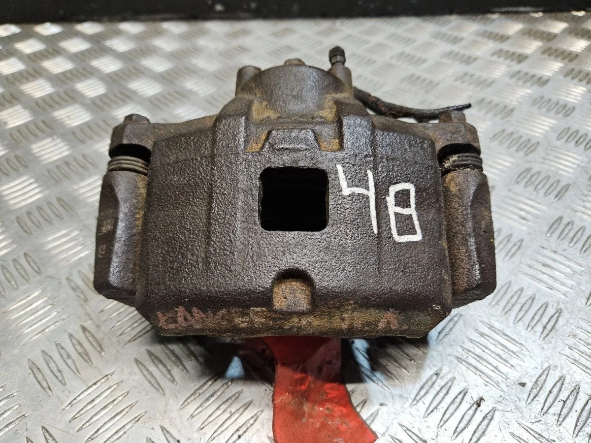 Суппорт передний левый на Mitsubishi Lancer 10