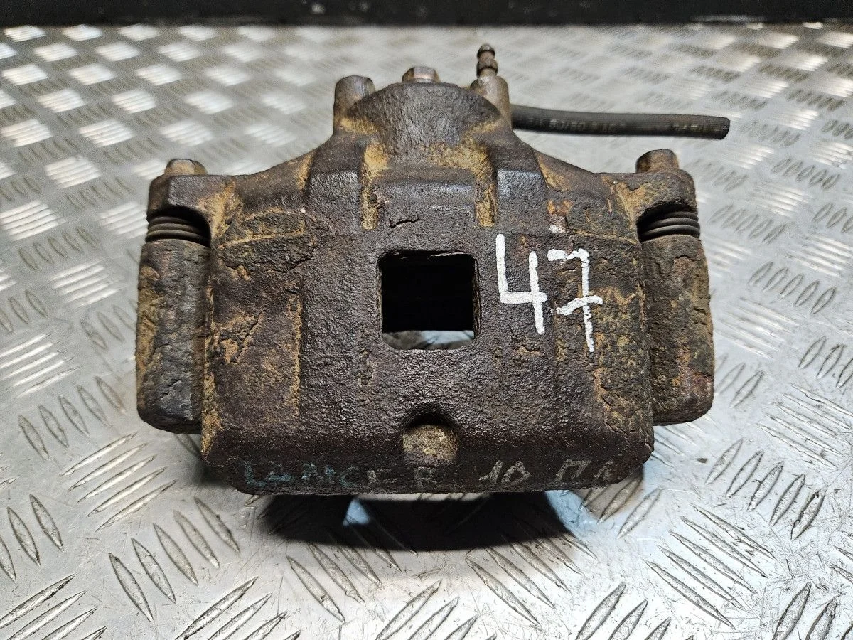 Суппорт передний левый на Mitsubishi Lancer 10