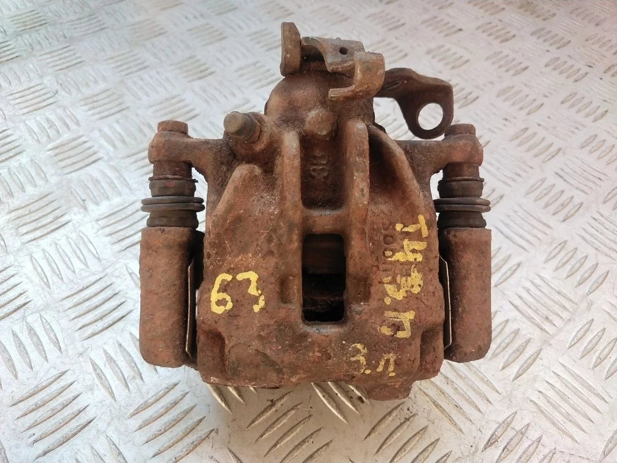 Суппорт тормозной задний левый VW Transporter T4