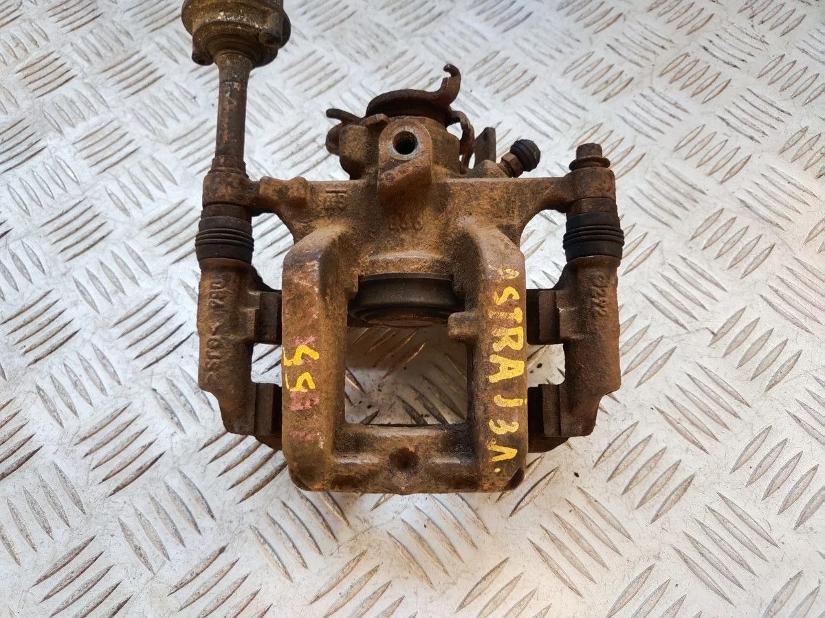 Суппорт задний левый Opel Astra J