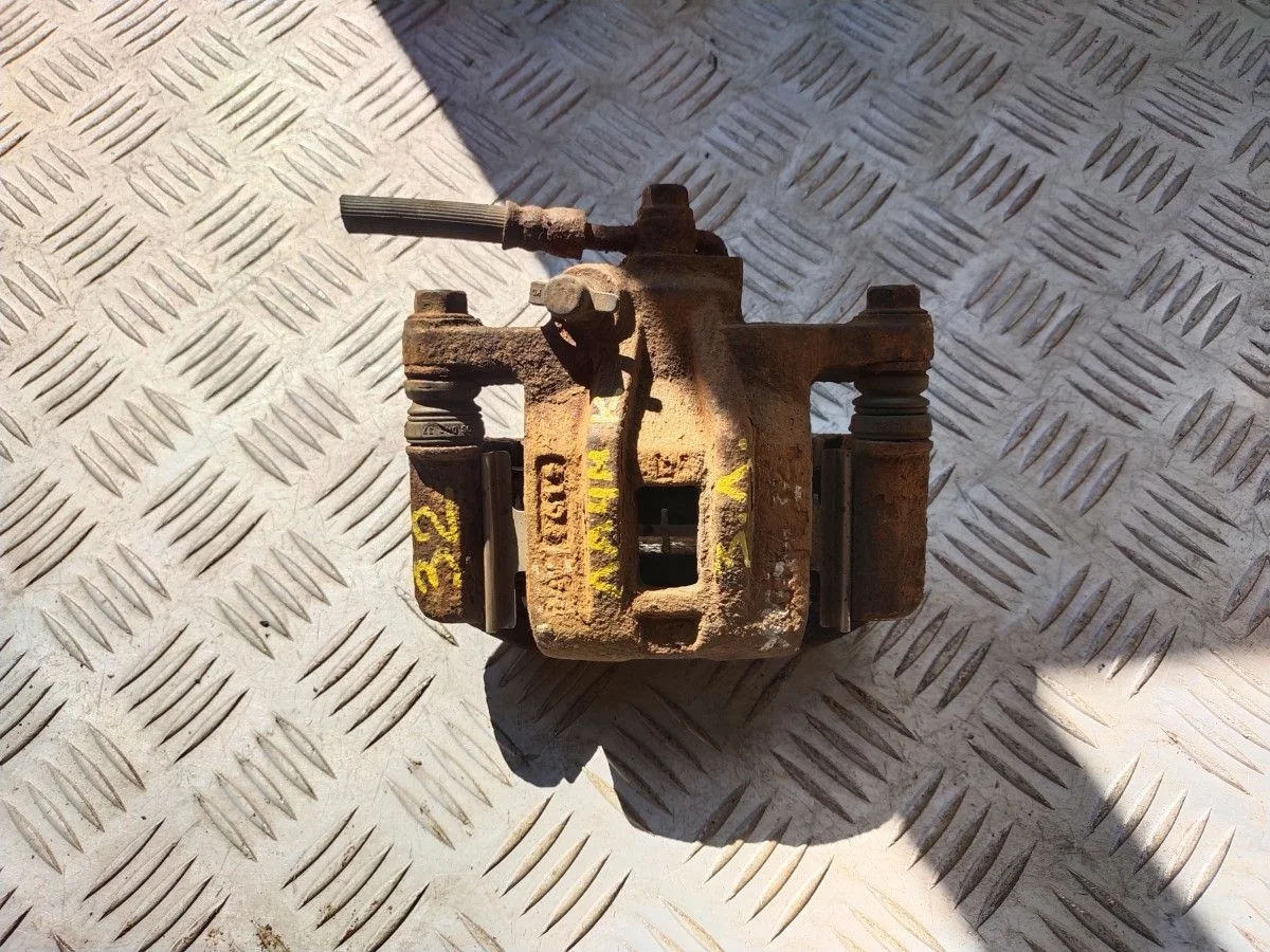 Суппорт задний левый Chevrolet Lacetti