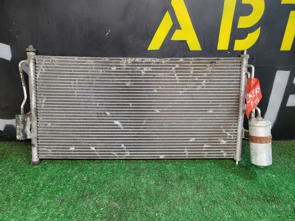 Радиатор кондиционера подкапотный на Almera B10