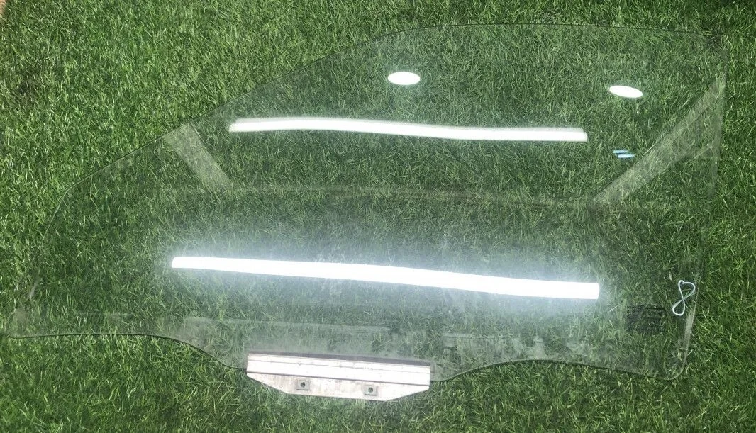 Стекло двери передней левой Daewoo Nexia