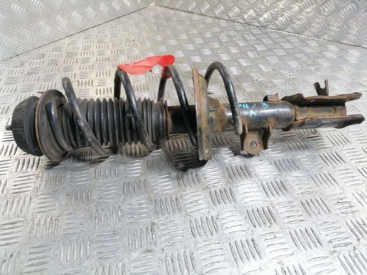 Стойка амортизатора передняя левая KIA Rio