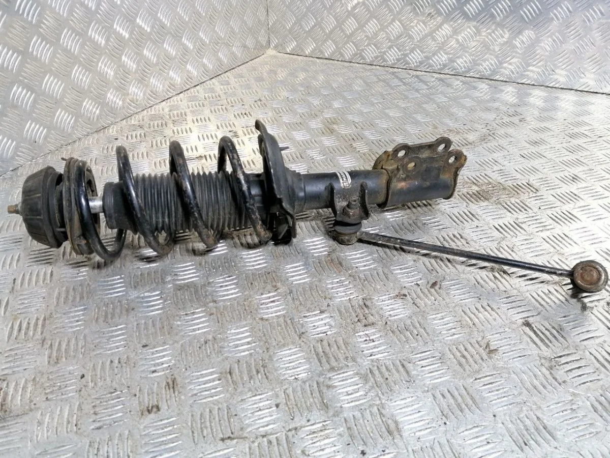 Стойка амортизатора передняя левая KIA Rio