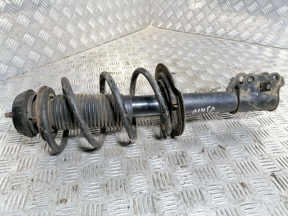 Стойка амортизатора передняя правая KIA Venga