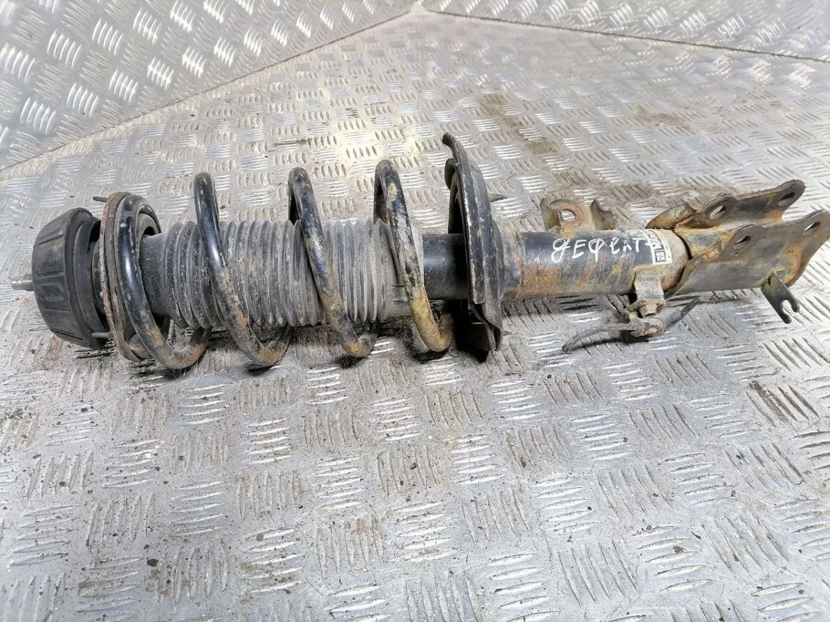 Стойка амортизатора передняя левая KIA Rio