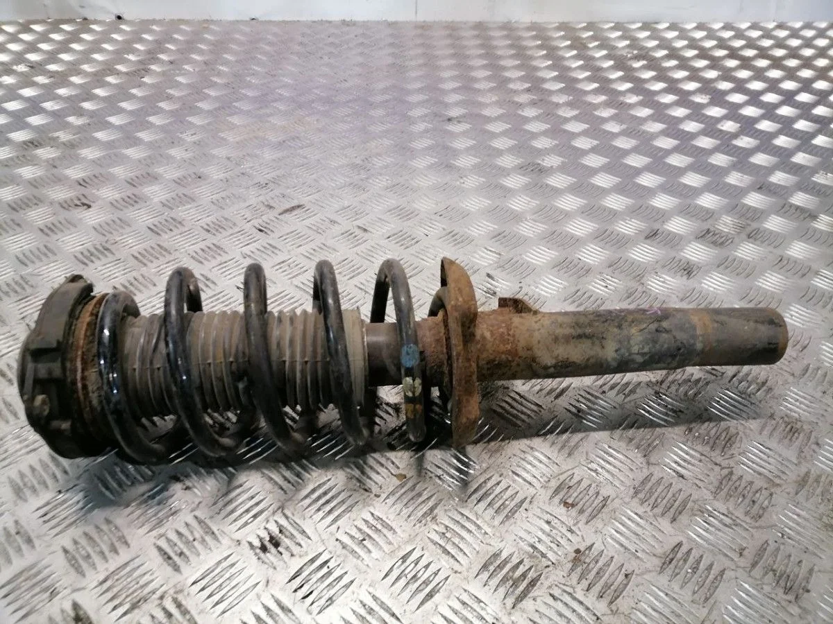 Стойка амортизатора передняя VW Caddy