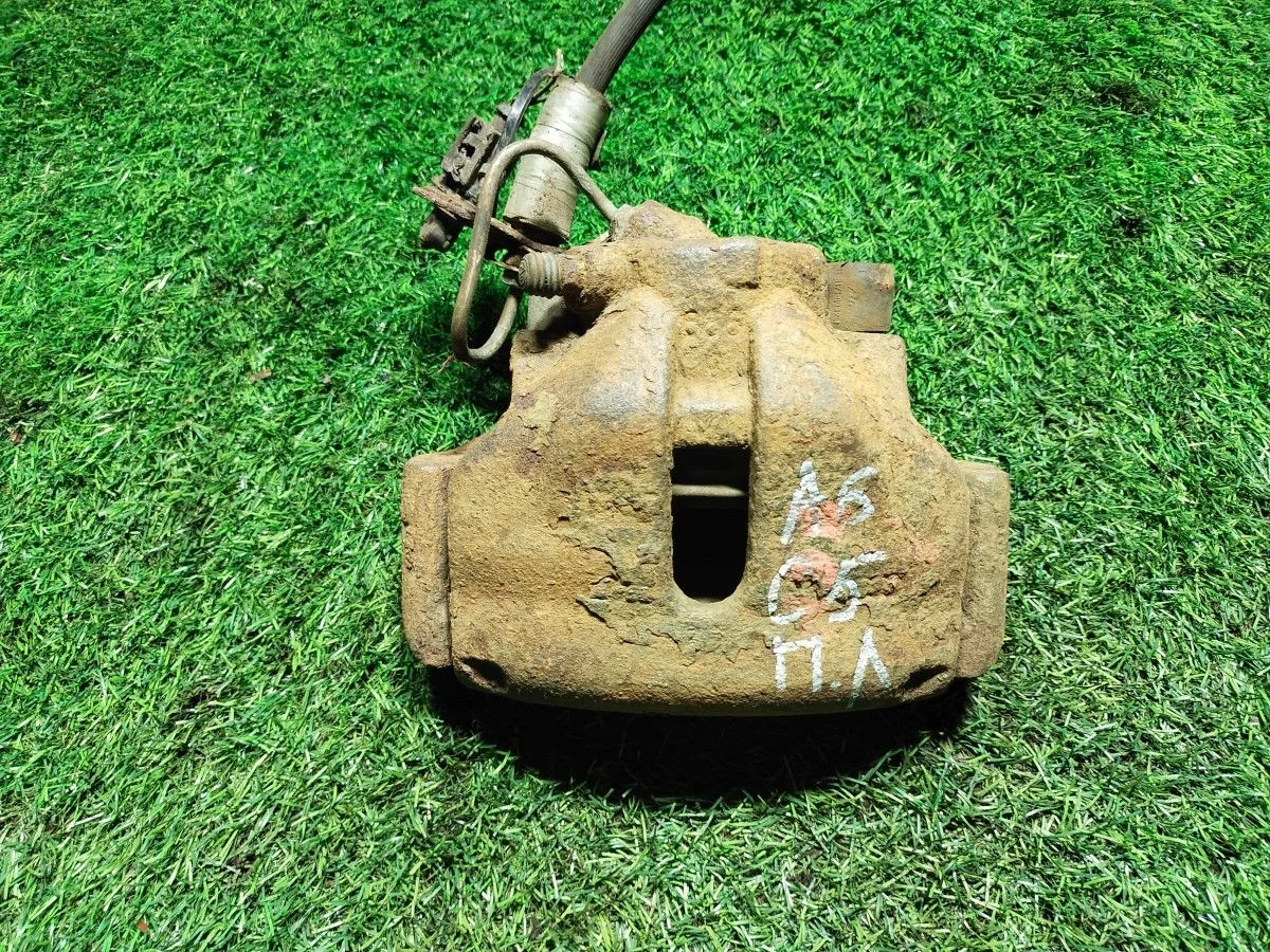 Суппорт передний Volkswagen Passat B5