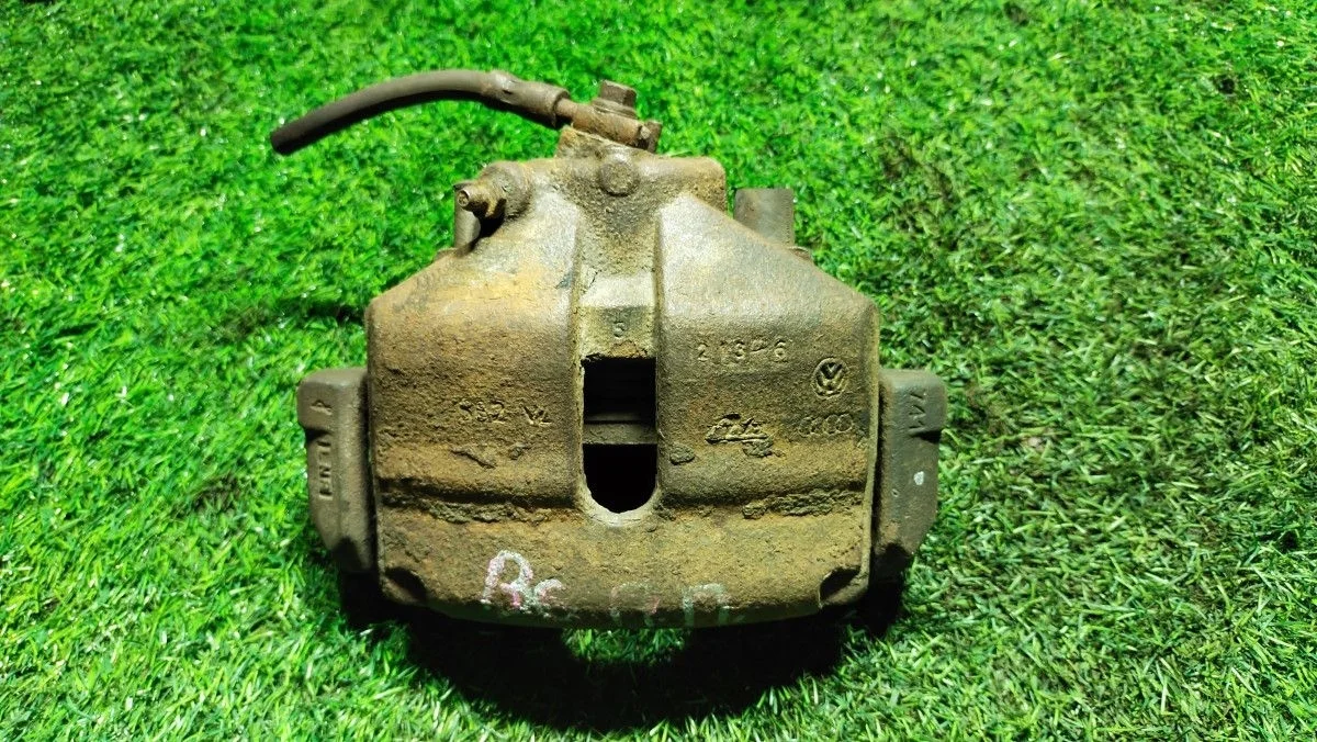 Суппорт тормозной Volkswagen Passat (B6) VI