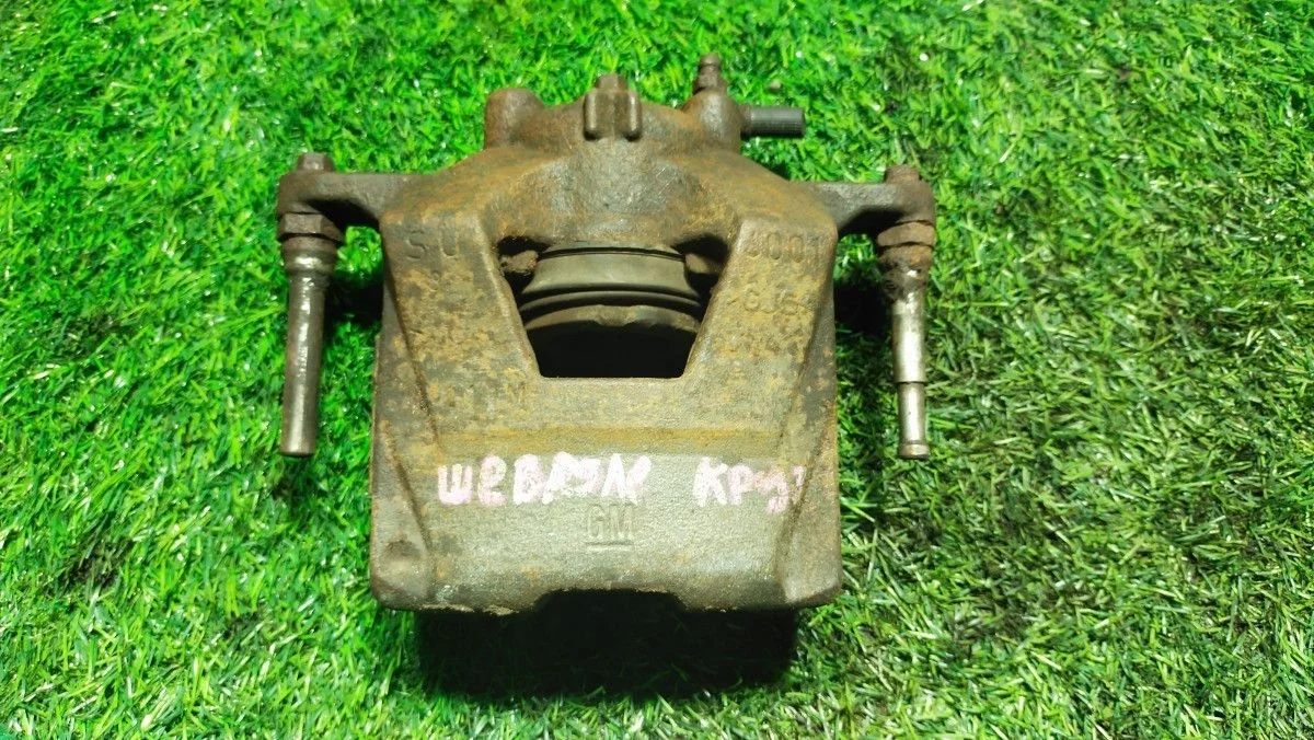 Суппорт тормозной Opel Astra J