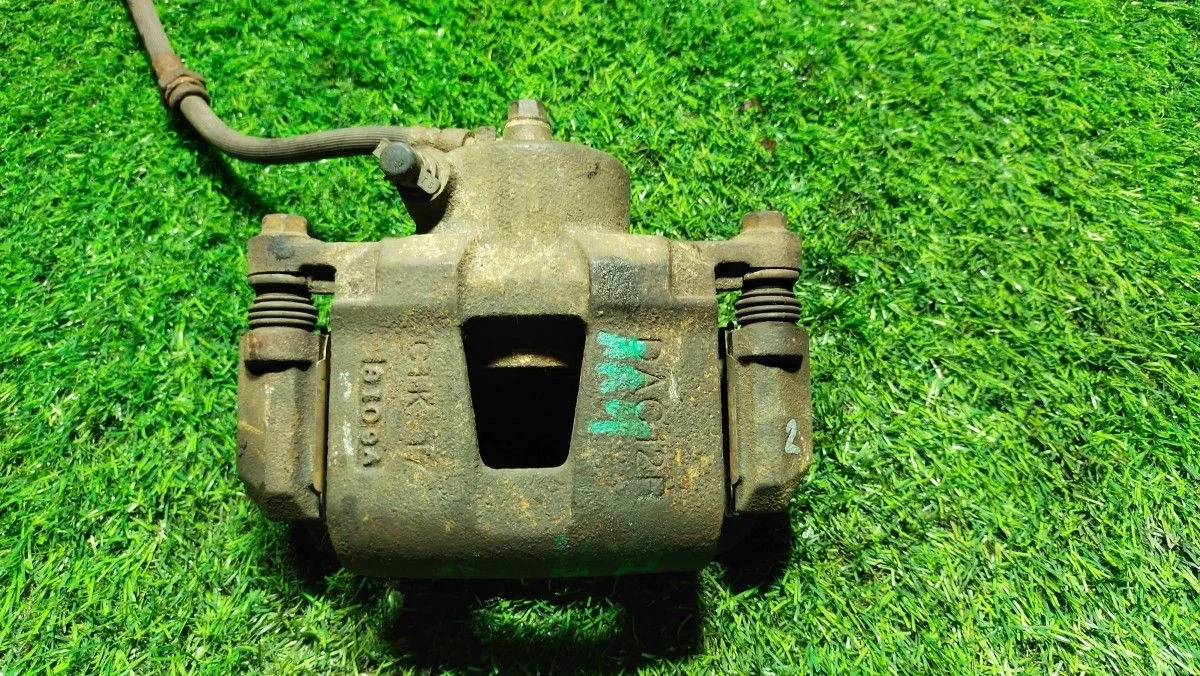 Суппорт тормозной передний Chevrolet Lacetti