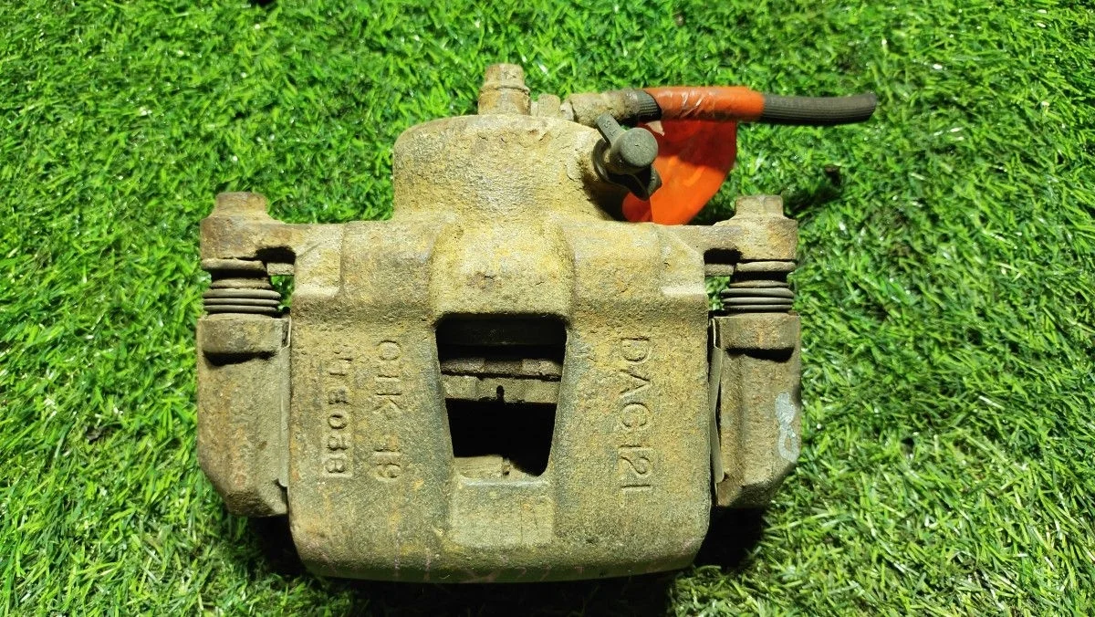 Суппорт тормозной передний левый Chevrolet Lacetti