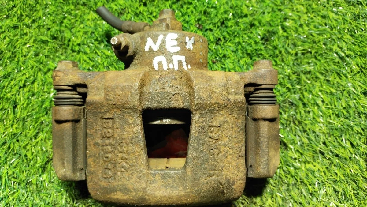 Суппорт передний правый Daewoo Nexia