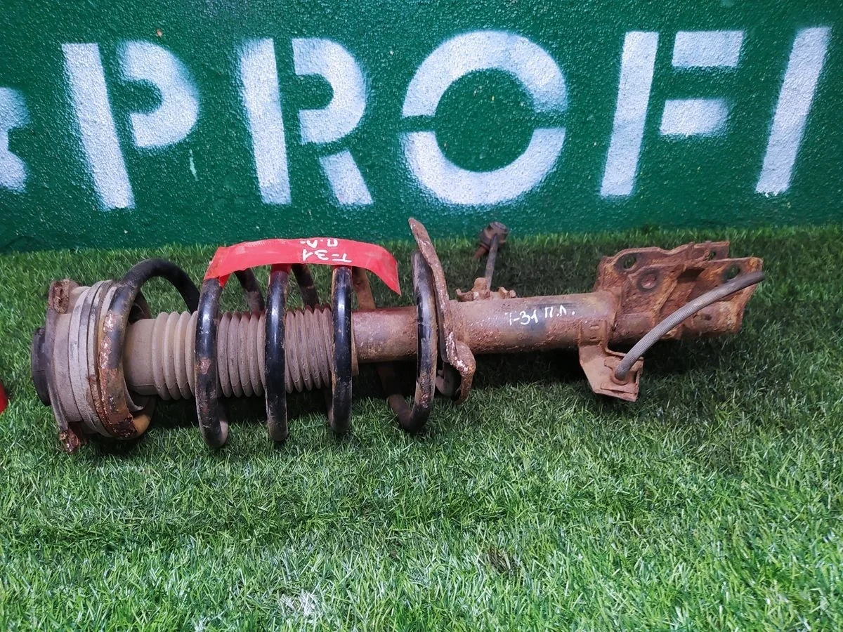 Амортизатор передний левый Nissan X-Trail 2 T31