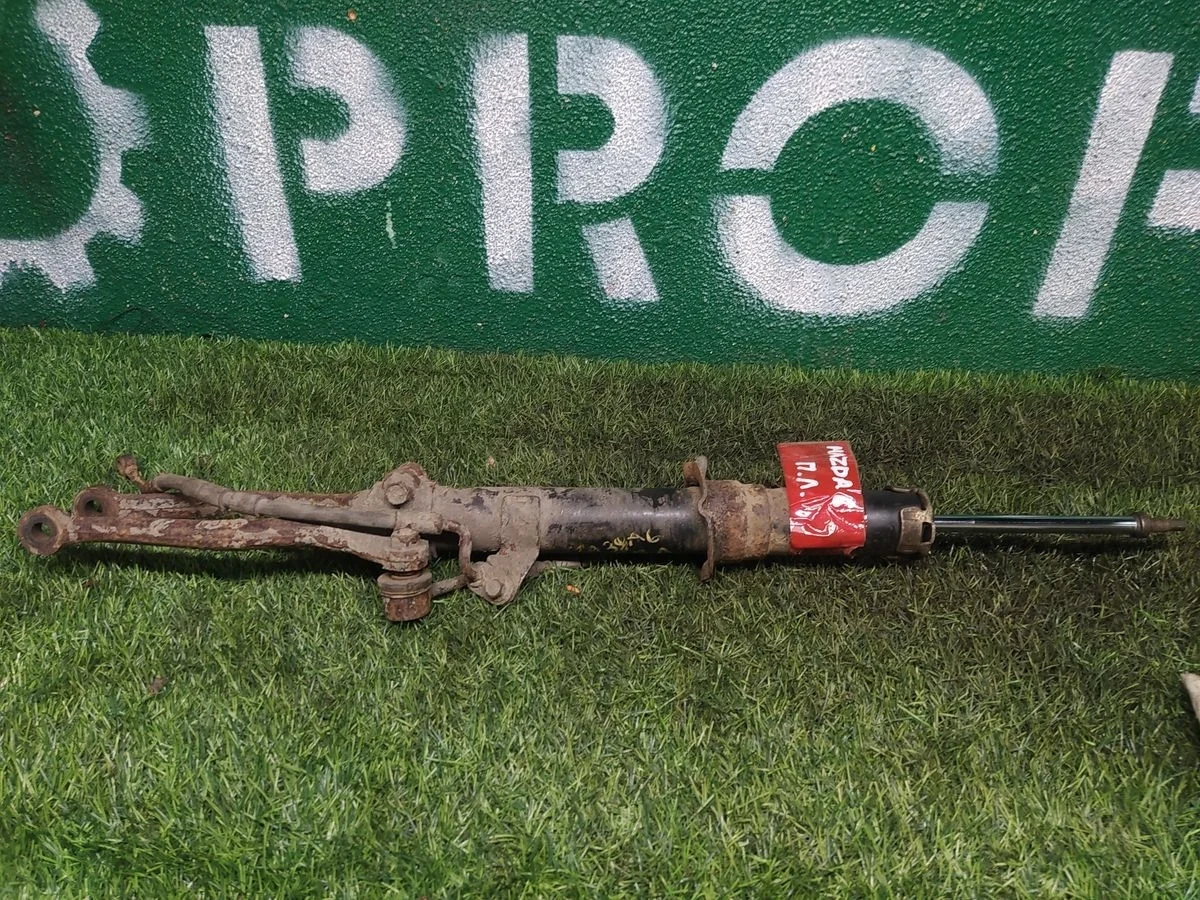 Стойка амортизатора передняя левая Mazda 6