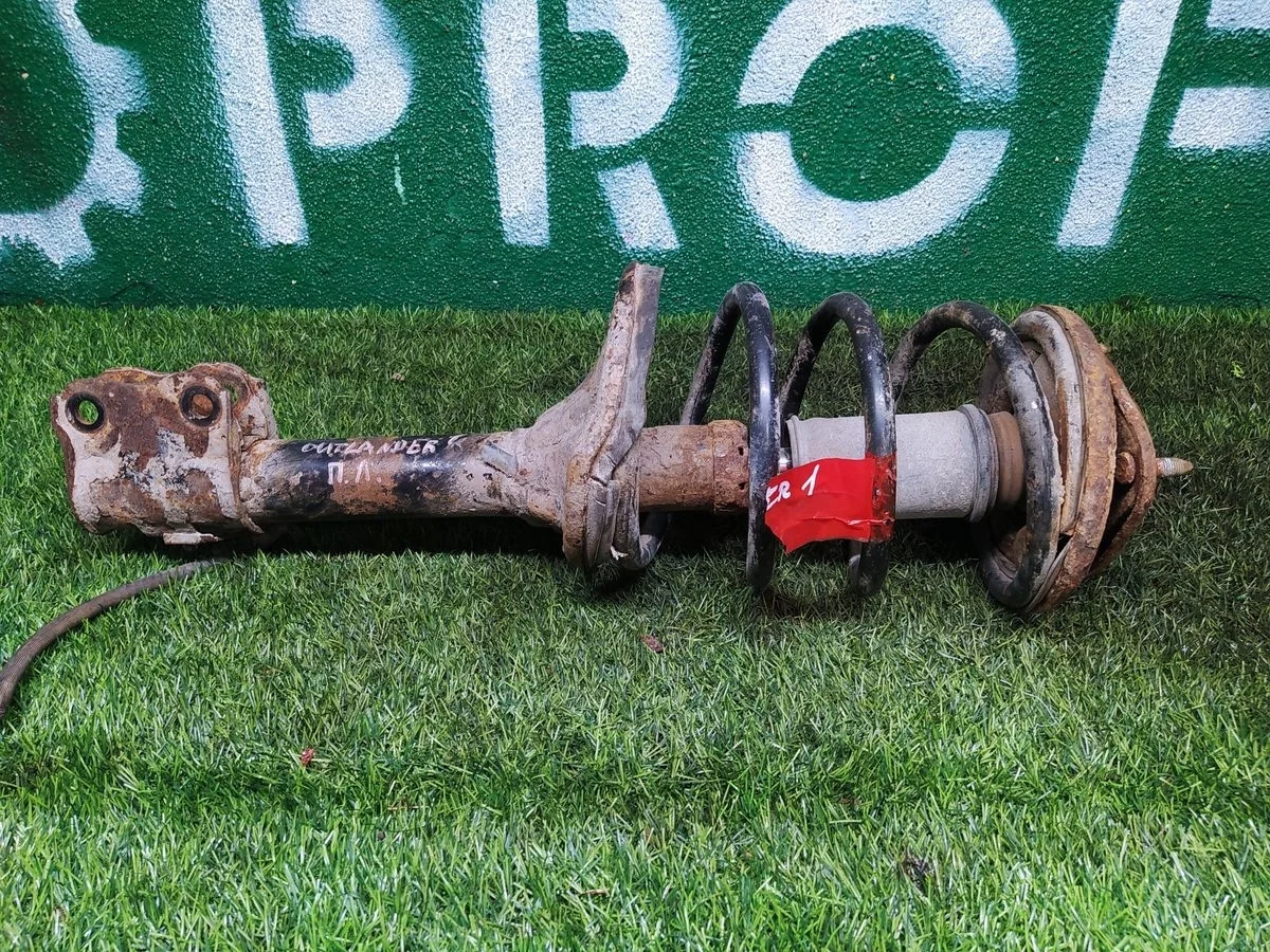 Амортизатор передний левый Mitsubishi Outlander I