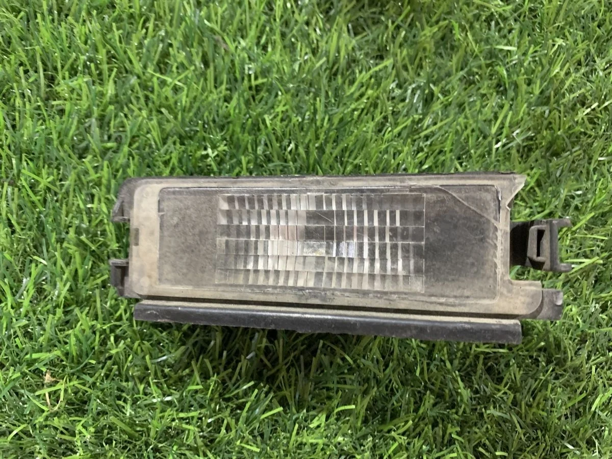 Фонарь подсветки номера Renault Logan