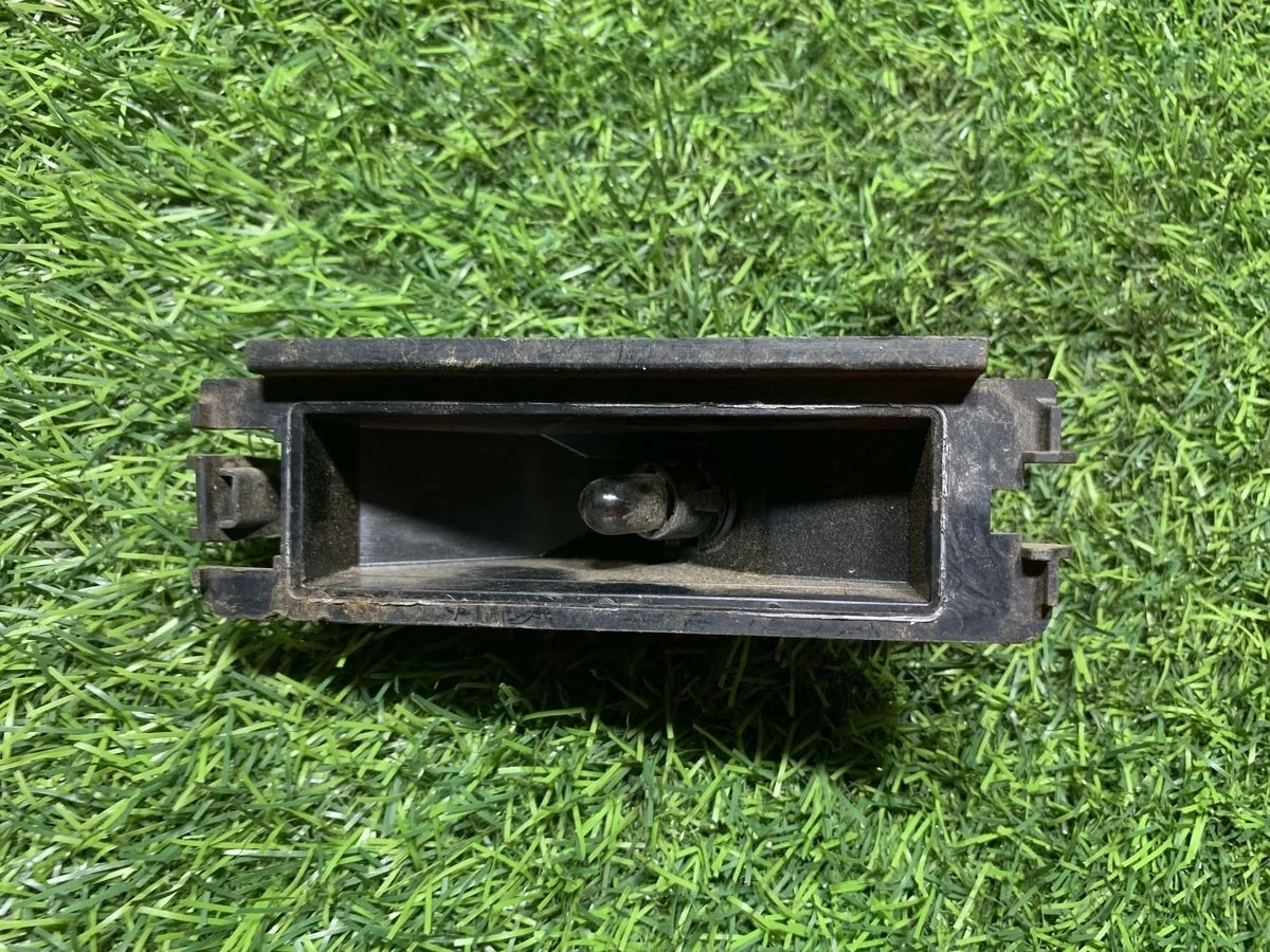 Фонарь подсветки номера Renault Logan