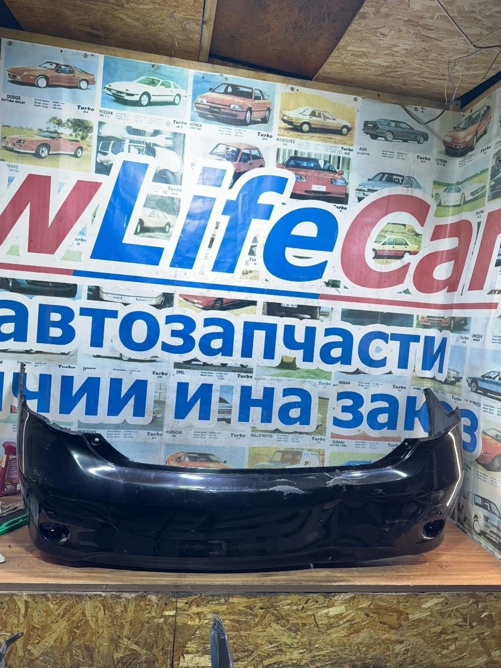 Бампер задний оригинал дефект Тойота Королла E150