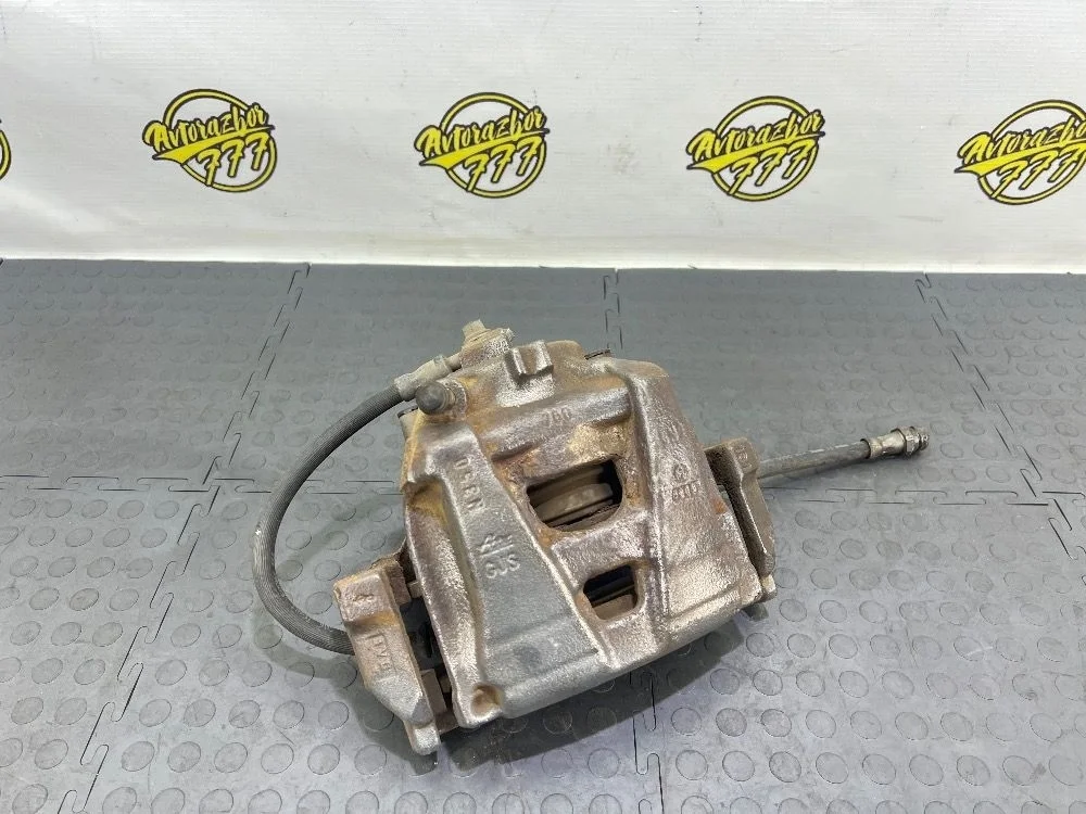 Суппорт тормозной передний правый Audi Q3 I (2011—2014)