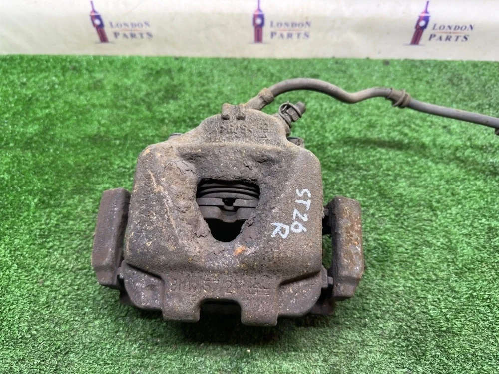 Суппорт тормозной BMW X1 20dX E84