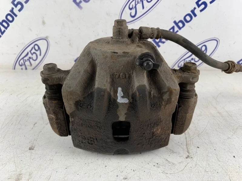 Суппорт Hyundai Tucson 2009 581102E000 JM 2.0 (G4GC), передний левый